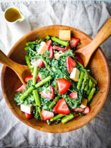 Smoked tofu, strawberry, and asparagus kale salad with creamy tahini dressing